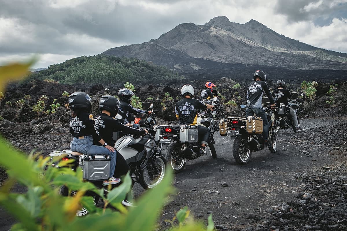 Riders crossing volcanic terrain